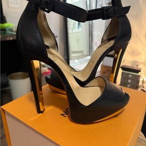 Christian Louboutin Black and Gold Heels